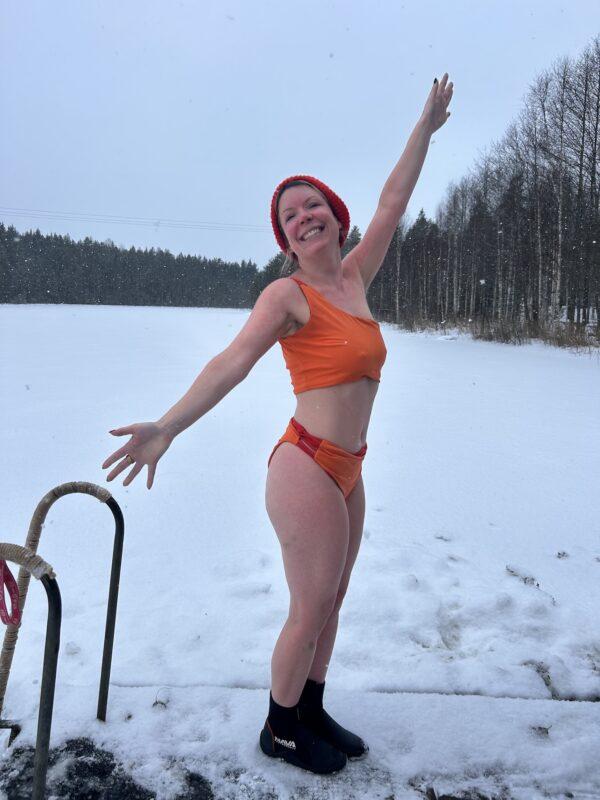 Woman celebrating after an ice bath during the Wild Winter Retreat at Shambala Gatherings