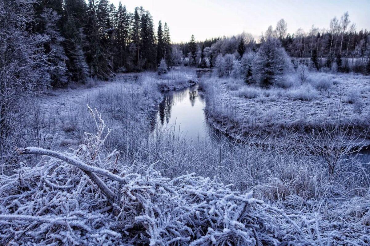 Frost-covered winter landscape and river near Shambala Gatherings retreat center